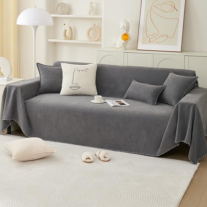 Charcoal grey couch cover with slip-resistant design and matching cushions