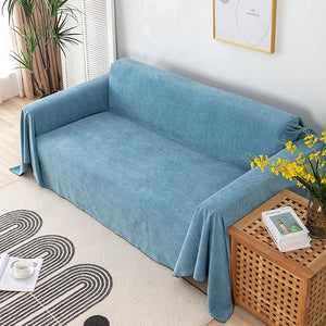 Soft blue couch cover with matching cushion covers for living room protection.