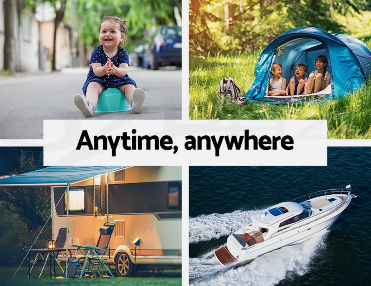 Family camping with portable camping toilet in use