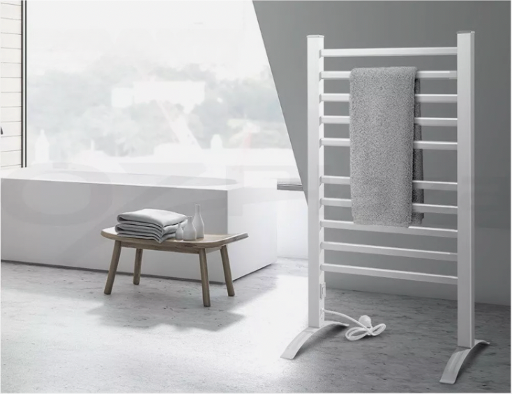 Modern heated towel rail in bathroom with chrome finish